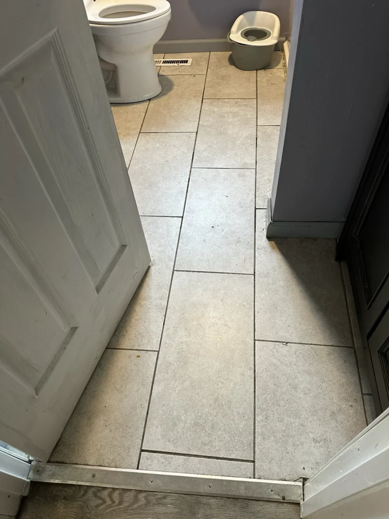 Before - Brand new tile with crumbling grout lines
